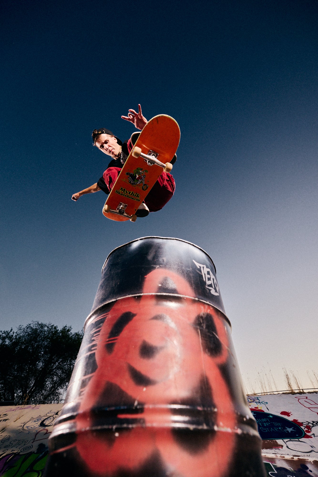 Parker DeMoux midair above a painted barrel.