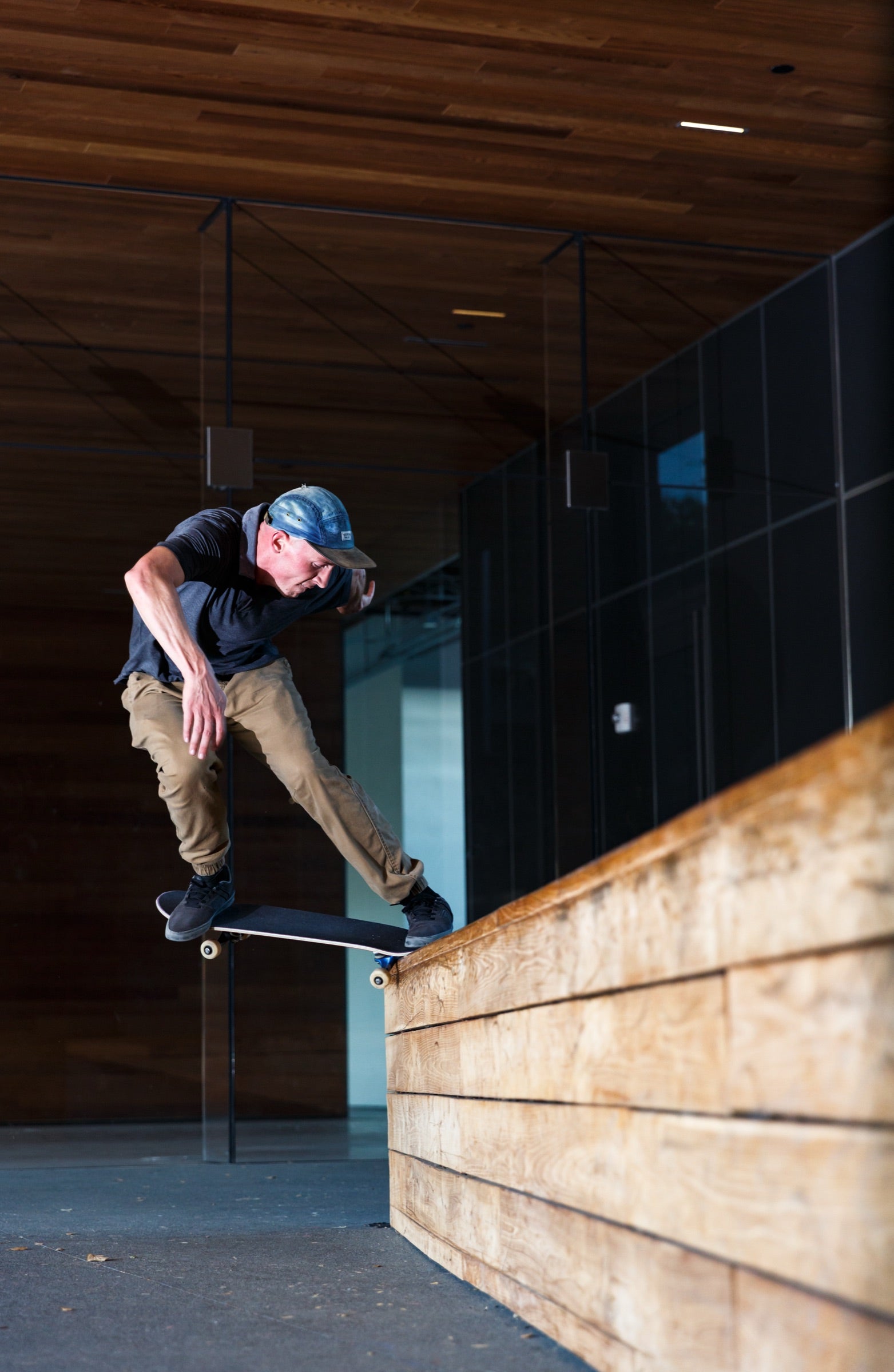 Andy Aced grinding a ledge beside a building.