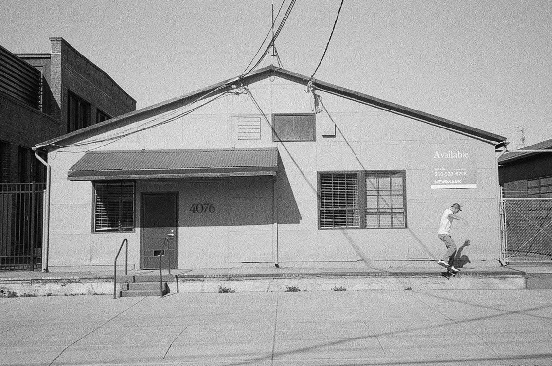 Andy Aced skating in front of a building.